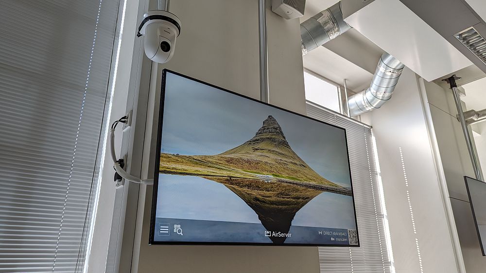 Mounted television screen in a classroom at Aston University.